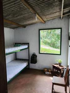 Ένα ή περισσότερα κρεβάτια σε δωμάτιο στο Camping do SER - Beliche