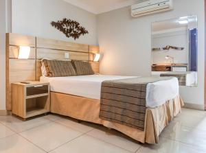 Cama ou camas em um quarto em BH Jaraguá Hotel