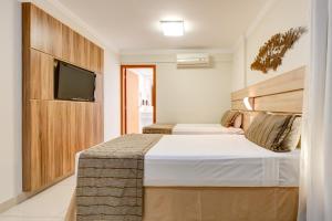 Cama ou camas em um quarto em BH Jaraguá Hotel
