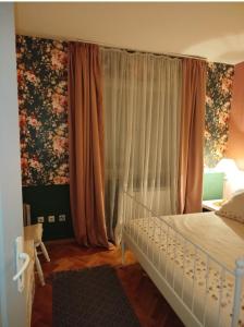 Postel nebo postele na pokoji v ubytování Gold Apartments