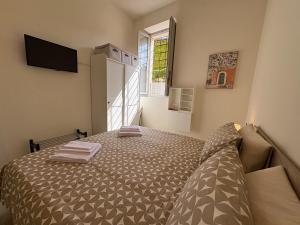 Postel nebo postele na pokoji v ubytování Arte, Business e Relax nel cuore di Piacenza