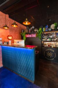 a bar with a laptop on a blue counter at Centrum Hotel in Akureyri