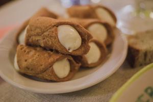 a white plate with a plate of food on a table at Appartamenti Il Criollo in San Gimignano +24 photos