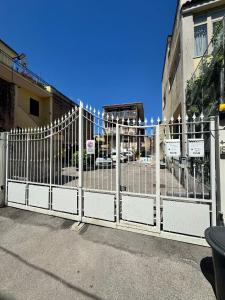 a white fence in front of a building at B&B Anna in Marigliano