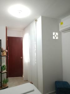 Postel nebo postele na pokoji v ubytování Hostal AMANECER COSTERO