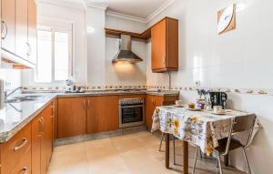 a kitchen with a table with a table cloth on it at Casa La Estacion in Olvera