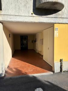 an empty hallway of a building with a door at Casa Rodo in Levanto +6 photos