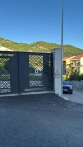 a garage door with a gate on a street at Georgijevic 2 in Budva