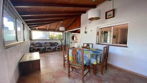 a living room with a table and a couch at Casa Domi in Valle Gran Rey