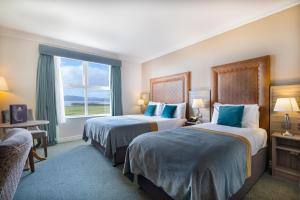 Postelja oz. postelje v sobi nastanitve Inishowen Gateway Hotel