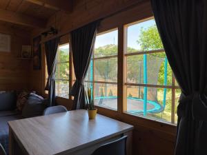 a room with a table and a large window at Brvnara RIĆKI in Cetinje