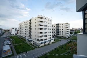 an aerial view of a city with tall buildings at Blvd Ivory Pipera nr 38 in Bucharest