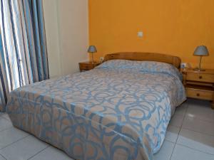 Postel nebo postele na pokoji v ubytování Sea Breeze Apartments