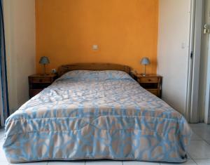Postel nebo postele na pokoji v ubytování Sea Breeze Apartments