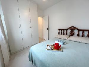 Postel nebo postele na pokoji v ubytování Delicinha, a 300m da Praia do Forte