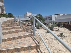 a set of stairs in front of a building at Apartamento Ura in Morro del Jable