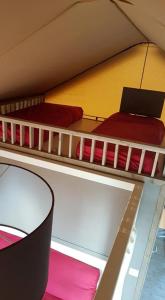 two bunk beds in a room with a laptop on it at Village Glamping Biscione in Petrosino