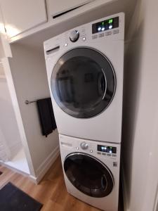 a white washing machine sitting in a kitchen at Adorable Pasadena Bungalow in Pasadena