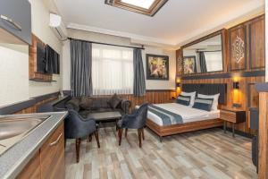 a hotel room with a bed and a sink at La Serena Taksim in Istanbul