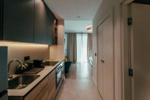 a kitchen with a sink and a counter top at BW Symphony Suites in Belgrade