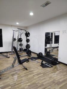 a gym with several treadmills and machines in a room at Swiss Garden resort residence by Moonlight in Kuantan +34 photos