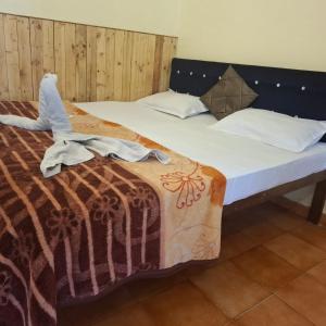 Ave Maria Guest House & Restaurant and Bar客房内的一张或多张床位