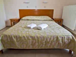 Postel nebo postele na pokoji v ubytování Sea Breeze Apartments