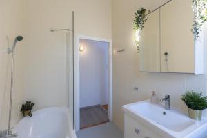 a bathroom with a toilet and a sink and a shower at TOP Location Studio at Deák Sqr in Budapest