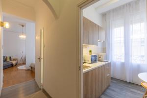a kitchen with a sink and a microwave at TOP Location Studio at Deák Sqr in Budapest