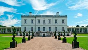 a large white house with a pathway in front at Spacious Apartment in London in London