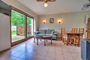 a living room with a couch and a table at Moulin Haut in Rouffignac Saint-Cernin
