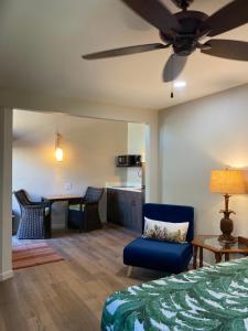 a bedroom with a bed and a table and chairs at Kona Kai in Sanibel