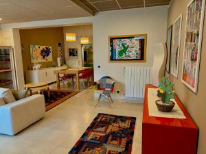 a living room with a couch and a table at Le More Apartment in Rutigliano