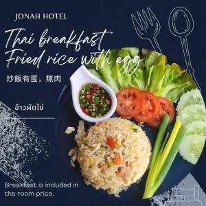 a plate of food with rice and vegetables at Jonah Hotel in Chiang Mai +52 photos