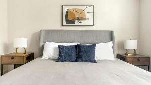 a bedroom with a large bed with two night stands at Landing Palmetto Apartments in Palmetto +45 photos