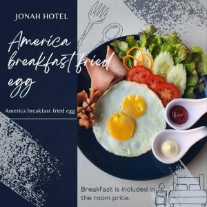 a plate of breakfast food with eggs and a salad at Jonah Hotel in Chiang Mai