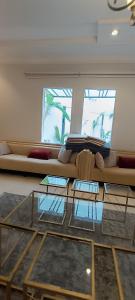 a living room with a couch and a glass table at استراحة الشيوخ in Taif