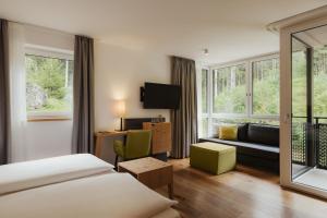 Postel nebo postele na pokoji v ubytování Waldrast - Forestside Living