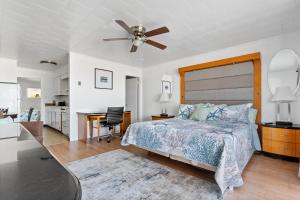 a bedroom with a bed and a ceiling fan at 2 Bed1 Bath on the Boardwalk by the Inlet in Ocean City