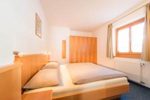 Ένα ή περισσότερα κρεβάτια σε δωμάτιο στο AppartmentPircher 2