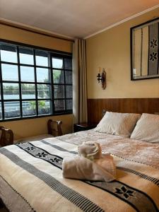 Postel nebo postele na pokoji v ubytování Hotel Boutique WenuPillan