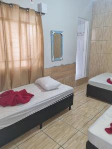 Postel nebo postele na pokoji v ubytování Pousada Flat do Igor a 400mts da Basílica de Aparecida