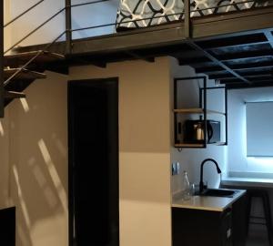 a kitchen with a bunk bed in a room at CoWork Hotel in Celaya