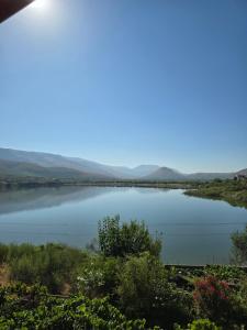 a view of a lake with mountains in the background at Lake View Loft 5 in Mursi +16 photos