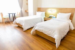 Cama o camas de una habitación en Hotel snowlion