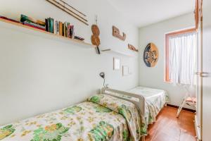 a bedroom with a bed and a shelf on the wall at Casa Lola - Goelba in Capoliveri