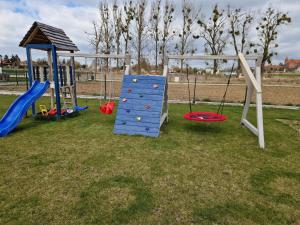 a group of playground equipment in a park at Namiot Oficerski Premium! in Kwidzyn