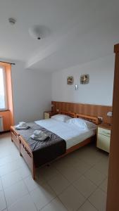 Postel nebo postele na pokoji v ubytování Hotel Montallegro