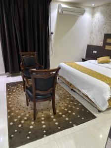 Postel nebo postele na pokoji v ubytování شقق روز للشقق المخدومة