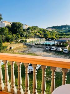 a balcony with a view of a parking lot at Rooms Ibrocevic in Ulcinj